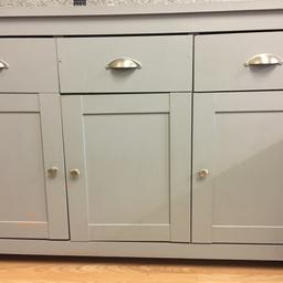 Grey cabinet.good for use however scratches on top and some of the paint has come off.The inside is a different colour 