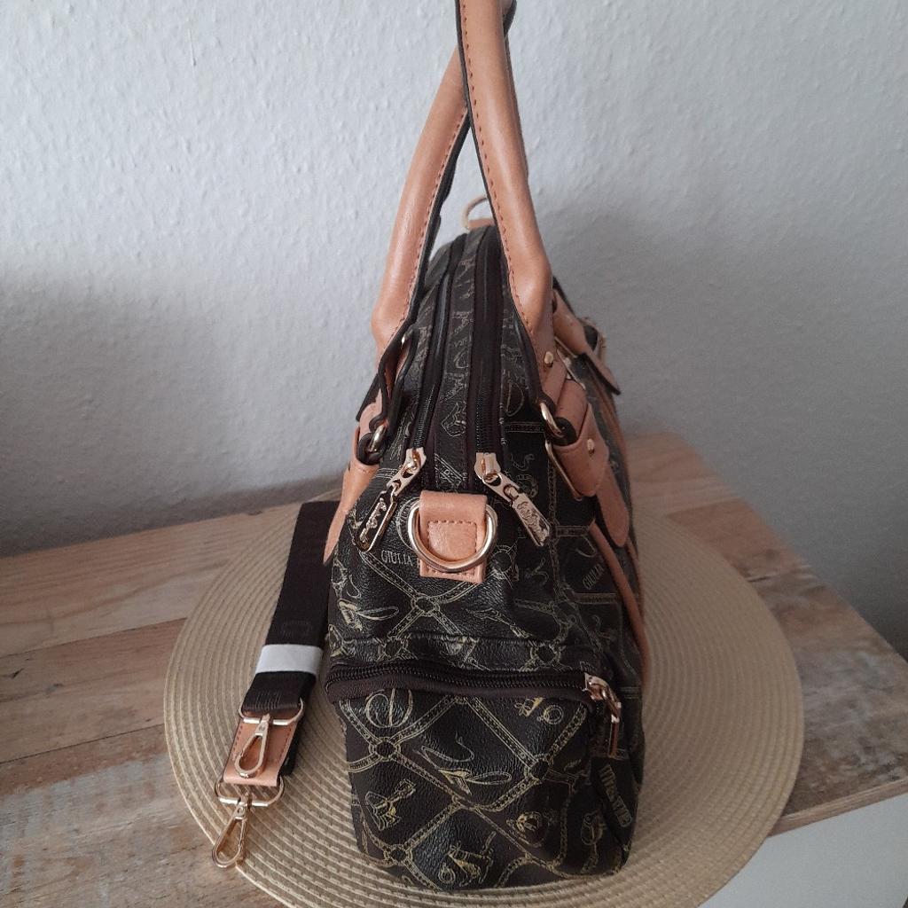 Tolle Handtasche kaum benutzt,Farbe -braun,Marke-Giulia Pieralli,von links nach rechts ca.35 cm,höhe ohne trage Henkel ca.22 cm .Tragegurt dabei.kein Handeln Festpreis