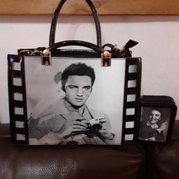 Lovely, black, patent leather bag and purse. Good clean condition, hardly used. All zips working. Unusual style, 3D Elvis pictures on the front of bag and purse. Ideal for Mother's day coming up, or an Elvis fan! £10.00. Cash on collection, L11. No posting.