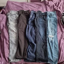 5 pairs men's jeans. (1pair looks brown in photo but are black)
2 distressed . 3 shades of blue, 1 black, 1 grey
price for all 5 pairs