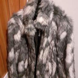 Boohoo faux fur jacket. has two pockets and thin belt (that can be detached if preferred) New and unused worn.