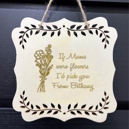 Floral Hanging Plaque

Floral Hanging Plaque
A charming way to showcase your love for your mum with this exquisite hanging plaque. Perfect for Mother's Day, it is a heartfelt token for all Mum's on their special day. This gorgeous wooden floral cut-out hanging plaque comes complete with a rustic rope hanger. Crafted from natural wood, it offers an organic, rustic appeal. Please note that due to the inherent variations in wood, the appearance of the personalisation may differ in depth, tone, and colour. H22 x W22cm. Personalise up to 4 lines with a maximum of 15 characters per line. Flower design is fixed.