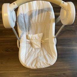 Mamas and papas musical baby swing.  Has a variable electronic swinging function (dial on the side) and plays 5 different lullabies with volume control. Baby is stepped in with an adjustable harness, and comes with bar and soft toys. Cover comes off to wash.
It’s in very good condition. Comes in original box.