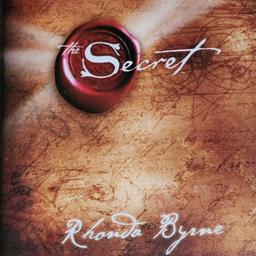 The Secret is a 2006 self-help book by Rhonda Byrne, based on the earlier film of the same name. It is based on the belief of the pseudoscientific law of attraction, which claims that thought alone can influence objective circumstances within ones life . The book alleges energy as assurance of its effectiveness.