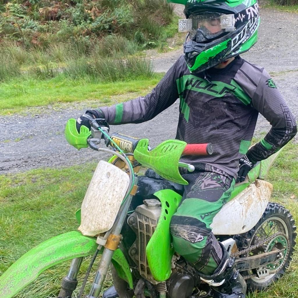 Here is my sons kx65 just had new chain an sprockets new seat cover new plastics unbreakable rfx anodised levers new grips recently had engine rebuild 2 hours ago have receipt to proove he needs an 85 so open to swaps