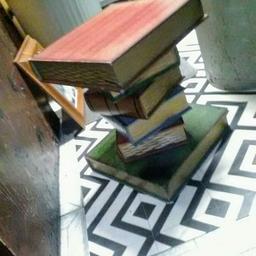 Vintage wood book coffee table. This item is a vintage item therefore will show signs of age related marks where appropriate. Can be used as a table or as a furnishing decor. BUYER COLLECTS PLEASE CASH ON COLLECTION B66. THIS ITEM IS COLLECTION ONLY..