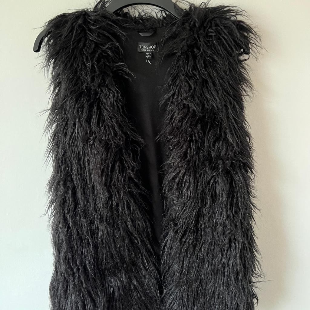 Beautiful , women fluffy gilet. Like new . It might have been worn once . Perfect condition . Free from smoke.