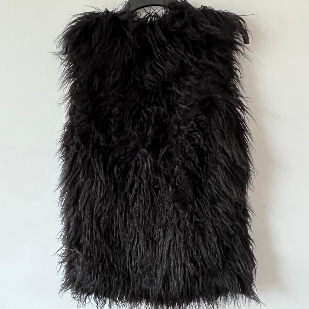Beautiful , women fluffy gilet. Like new . It might have been worn once . Perfect condition . Free from smoke.