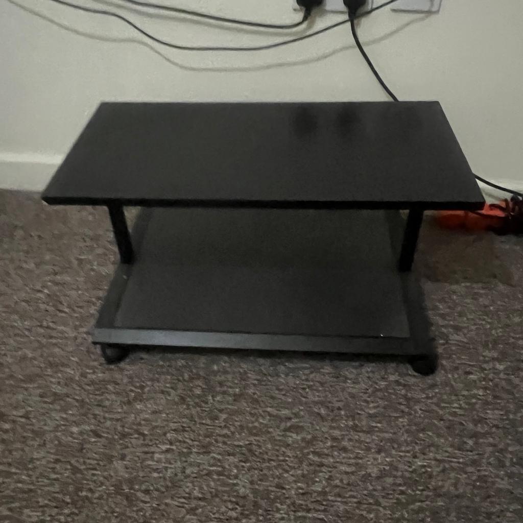 Black wood tv stand with 4 wheels.
The unit is in good condition.

Priced at £10
Collection only.