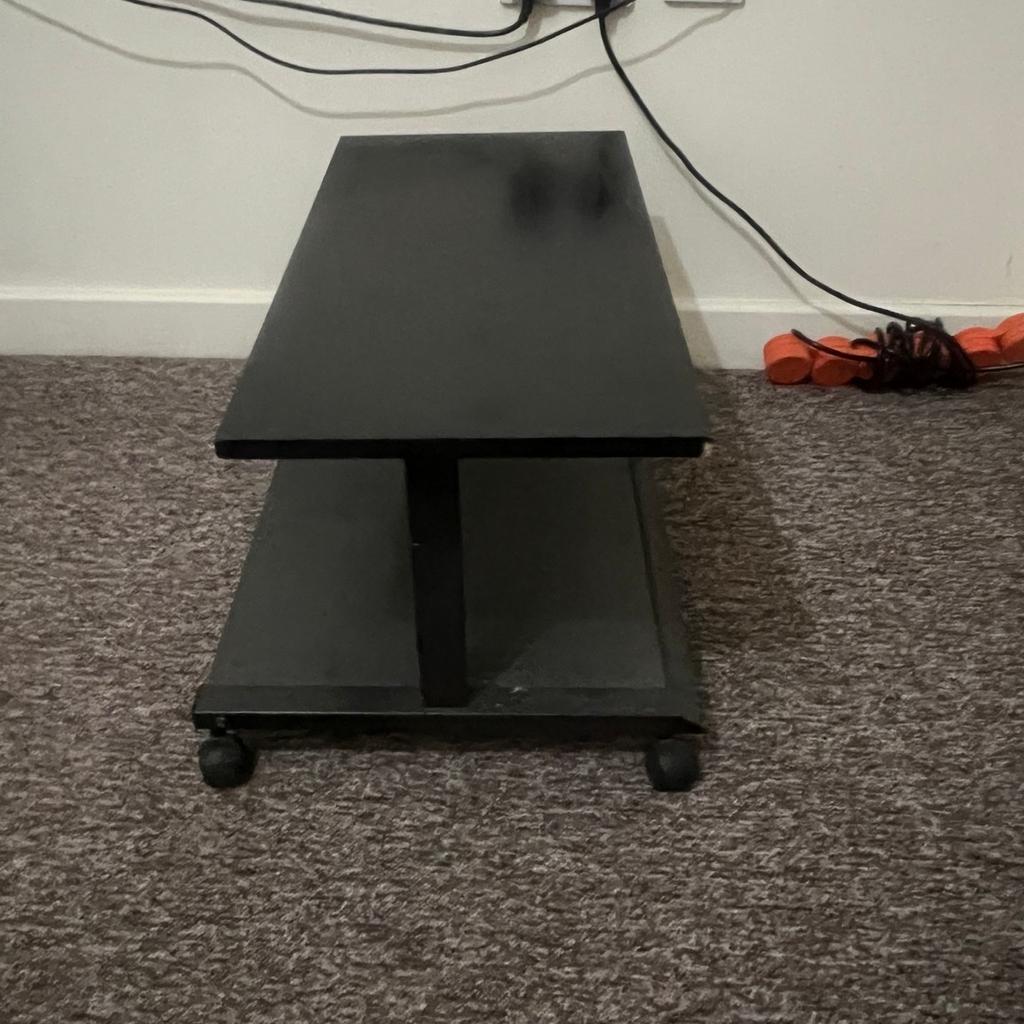 Black wood tv stand with 4 wheels.
The unit is in good condition.

Priced at £10
Collection only.
