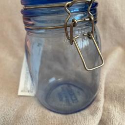 Heavy glass storage jar with metal air tight fastener.from IKEA.height 17cm new item Been £3.50