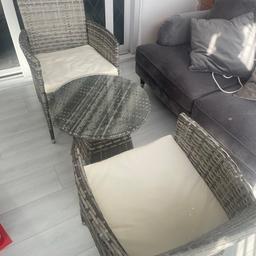 Two rattan chairs with glass table. Like new condition. They have always been kept indoors and have barely been used in the conservatory. Was purchased for close to £200 last summer