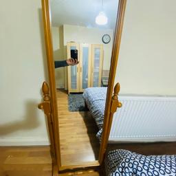 Wooden long standing mirror 180 degrees movement in good condition. Collection from bd7.
