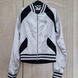 Ladies Vintage authentic Rocawear satin bomber jacket. Size M. White. Zip. Has been worn but plenty wear left. Been in storage so will need a light rinse. Has faint marks at armpit of jacket which should come out with Vanish. Pls bear in mind as NON REFUNDABLE!! Lovely authentic jacket for your spring/summer wardrobe!