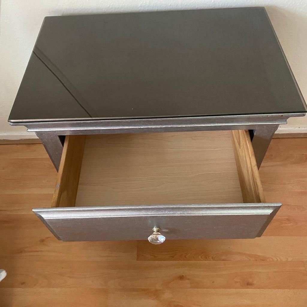 Solid wood bed side table with 2 deep drawers excellent quality condition & strong has a glass on top, the measurements are:
69W, 66H, 45D
