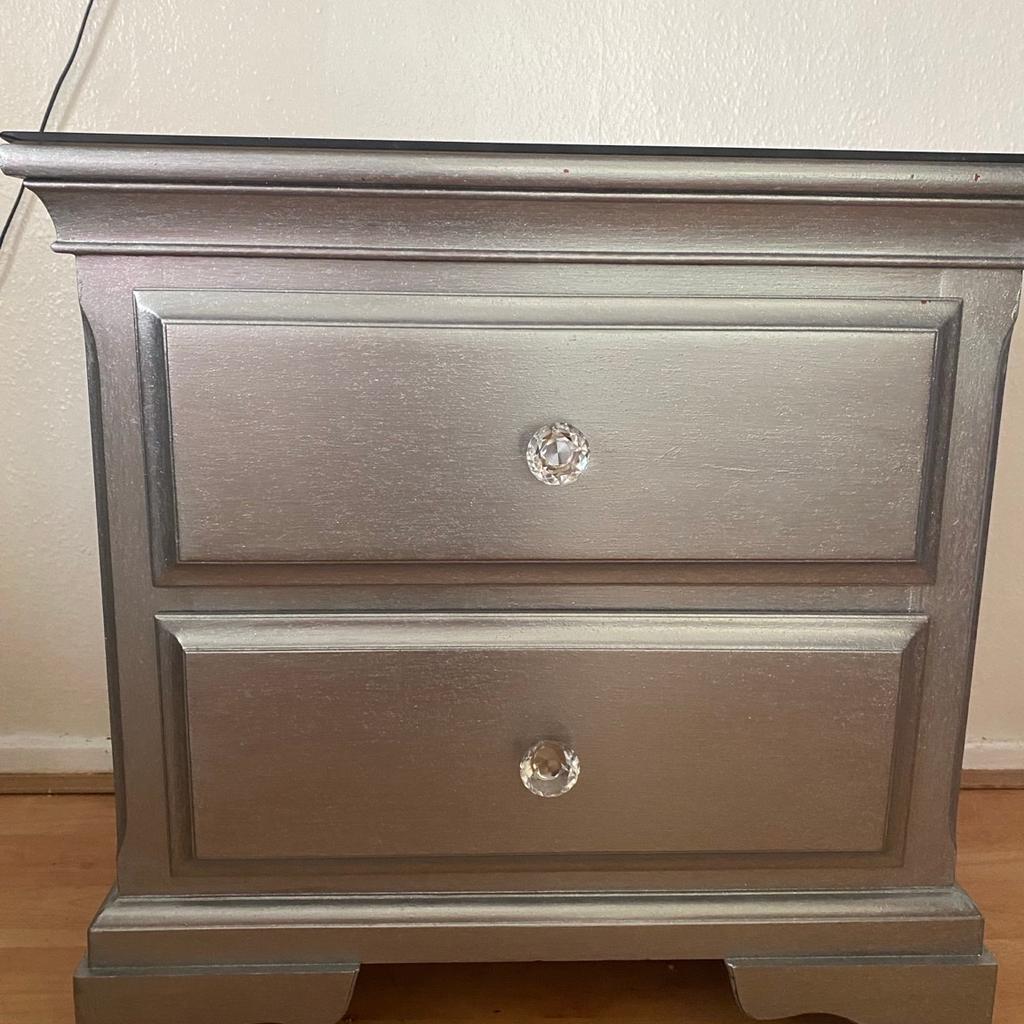 Solid wood bed side table with 2 deep drawers excellent quality condition & strong has a glass on top, the measurements are:
69W, 66H, 45D