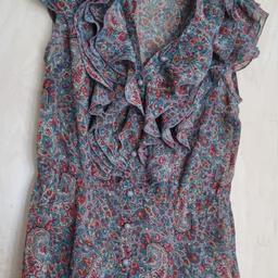Cute paisley ladies top. Size 10. Lovely grey buttons. Has elasticated waist for a comfy fit. Frills at front. Looks gr8 with trousers or straight skirt. Camisole to be worn underneath. Lovely paisley pattern and colours. Has been worn but plenty wear left. A good addition for your wardrobe.
