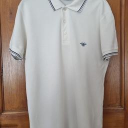 Mens Dior Polo Shirt. Size 48. White with bee motive. Pit to pit approx 20". Shoulder to hem approx 27".Has been worn but plenty wear left. Very slight pull at front top left of shoulder (pls see pic as not refundable). Will need to be rinsed as been in storage. Faint stain marks at pits which can be removed with Vanish (sorry, but I ran out). Nice shirt which can be brought back to life. Gr8 for your spring/summer wardrobe! Classic and authentic!