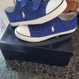 gorgeous blue and white pair of Ralph Lauren trainer/shoes. never worn, inly tried on. be great addition to summer wardrobe for them sunny days. Size UK 2 junior . as seen on box £60 was originally paid for them. price is negotionable