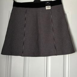 A lovely black and white mini skirt fully lined 
Measures 18 inches long
Excellent condition never worn with tags
From smoke free and pet free home