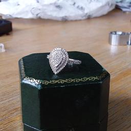 In beautiful condition ladies 9ct white gold ring, 0.50 carat of brilliant cut diamonds in a double halo pear shape setting, fully hallmarked for gold and diamond content, approx size K - L