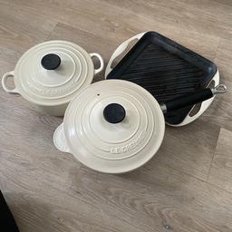 Set of three Le Cruset cooking set. 1 x casserole pot, 1 x saucepan and 1 x griddle tray. 
Colour is cream and black.
