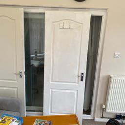 White panel wooden door with chrome handles and coat hooks in vgc 29 1/2 inch wide x 79 1/2 inch tall available for collection from Filey tel 07742951278