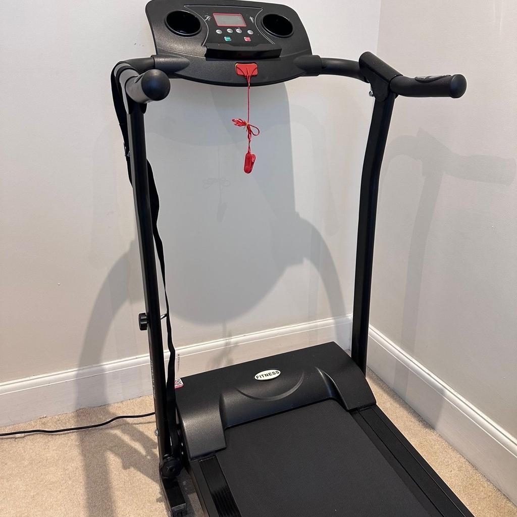 Black treadmill/running machine
Can be folded up, but must be held up with straps (provided) if folded standing.