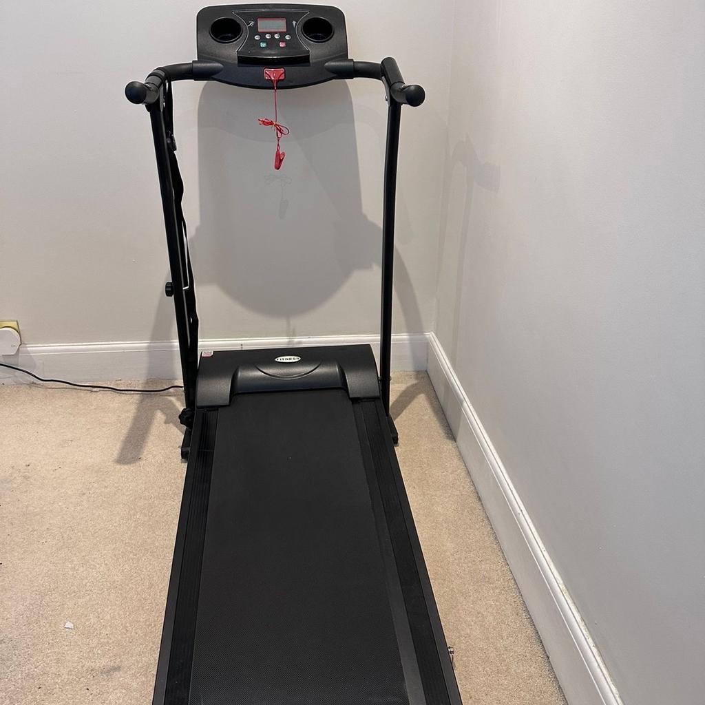 Black treadmill/running machine
Can be folded up, but must be held up with straps (provided) if folded standing.