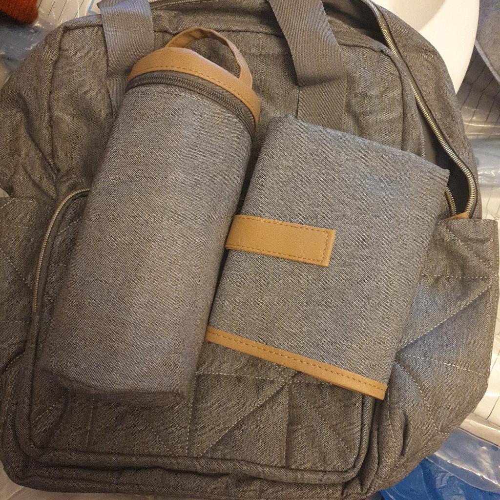 brand new never used baby bag with bottle holder and foldable changing mat comes as a matching set in grey so can be used for boy or girl collection only wv2 £12