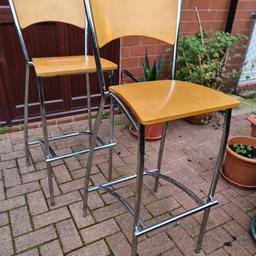A pair of stylish and strong stools, preloved. Made of chrome and wood.