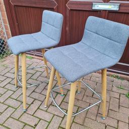 A pair of high stools, preloved. Dark grey in colour and hard-wearing cloth material.