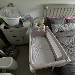 Shnuggle next to me cot, two sets of bedding to fit, baby bath, top and tail, changing mat, nappy bin. O’baby changing unit also for sale £150