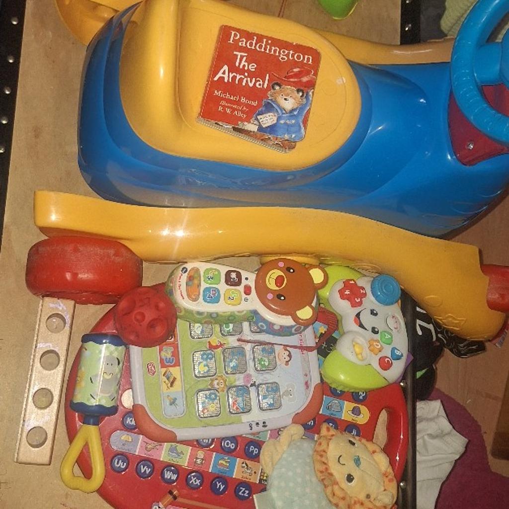 wooden blocks, VTec Grow and Go Ride On, non working kiddizoom camera, rattles, teethers, abacus, ball, VTec peek and play phone, junior kidpad, Fisher-price game controller, Chad Valley educational pad, Paddington Book, VTec crawl & learn bright lights ball, Sainsbury's pull along Dinosaur, Argos multi toy triangle, Keel Toys St Bernard, etc.
My kids have outgrown these.
Several will need new batteries and all should be cleaned prior to use due to being in storage for a few years.