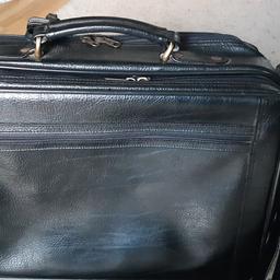This stylish and versatile briefcase/overnight case and laptop bag has numerous securely zipped pockets and spaces for all your belongings on the move.

The main compartment has securing straps to keep your clothes etc. in place and is approx 42cm x 30 cm x 10 cm deep. There is also :-
a zipped pocket in its lid.
a compartment opens flat giving useful pockets for phone, pens, cards etc and a zipped pocket as an alternative place for your laptop.
a smaller zipped pocket on the outside front of the flap.
another large zipped compartment with a depth of approx.4.5cm- 2 sections one for your laptop and the other for papers etc..
On the outside another zipped pocket .

There is a strong grab handle, detachable, adjustable leather shoulder strap, luggage label and 4 feet provide protection to the bottom when setting down.

Overall dimensions approx 44cm x 33cm x 16cm.

M&S brand, used but doesn't really look like it, couple of very slight scuffs if look hard.

All in working order.