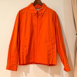 Brooks Brothers men's brand new bomber jacket. Size - medium. Colour - Orange. The jacket includes a collar, buttons on the sleeves for adjustment and pockets at the front and an inside breast pocket. Brand new (original tags still attached) and in excellent condition.
