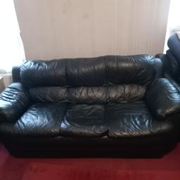 Leather Three seater sofa set along with 2 Armchairs and footstall. Price negotiable