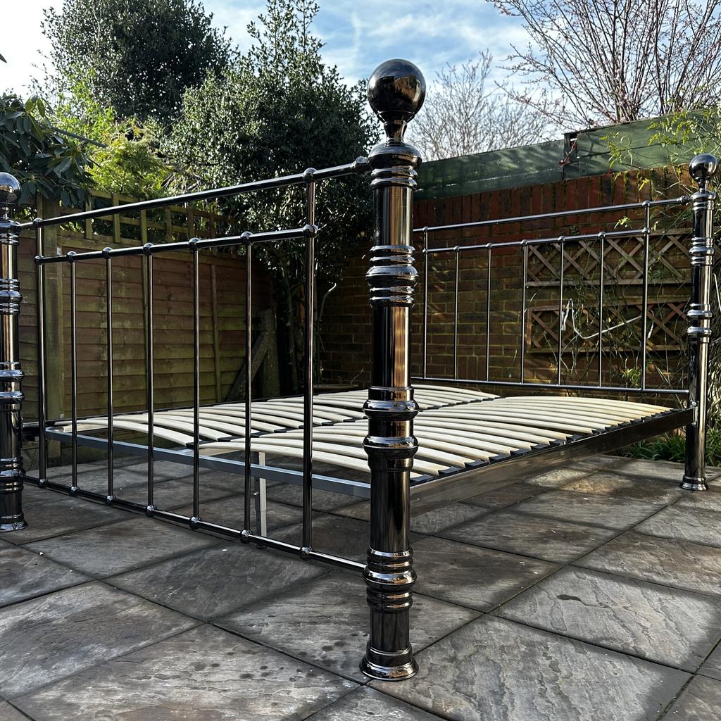 This stunning Dreams Metal King Size Bed frame is in superb condition, just a few minor scratches, pumps, nicks, marks. NO issues and was well looked after Please see pictures.

If you’re looking for a grand superior bed, this metal bed frame is your bed. Plated with a black nickel finish, it is a strong and bold bed that will make a statement in your room. Matching finials and beautifully railed, this bed is stunning in all its glory.

Sprung slats foldable base, with three feet along with metal bars for extra support.

It fits UK 5ft king size mattress.

Original price was over £750 and a similar one is called HUGO is on sale for £779 see link 

Approx.

L: 220cm

W: 165cm

Headboard H:135cm

Footboard H: 115cm

Collection from Sunbury,