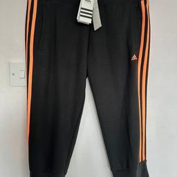 brand new 3/4 adidas joggers size uk new with tags. Black and orange. see other items for sale too thanks.