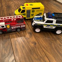 Three Large Vehicles - Police, Fire and Ambulance.