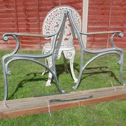 Here we a have a  pair of  garden cast iron bench ends. In great condition, in need of a good clean and painting, nuts and bolts are rusty. It has the wood which is in good order but has two planks missing. Wooden handles will need replacing. Ref.  (#825)

  Height........ approx  32 inch / 81 cm
  Width........  approx  23 inch / 58.5 cm 

Pick up only, Dy4 area. Cash on collection.