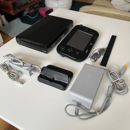 Nintendo Wii U console complete set + wireless gamepad charger. EU version.

Console works fine with no known issues.