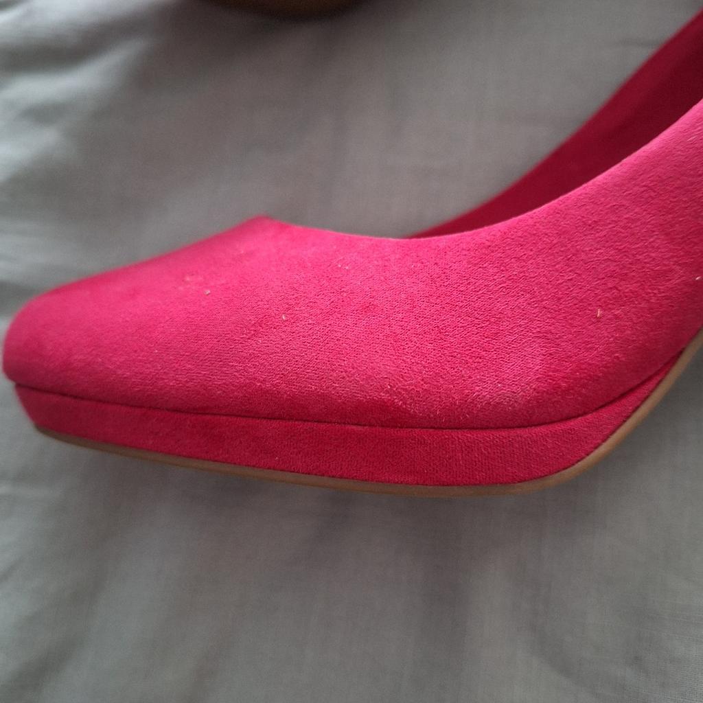 Pink suede, high heeled shoes with small platform. Very elegant, never worn, bought for daughters wedding and decided on different colour. From smoke and pet free home. Buyer collects.
