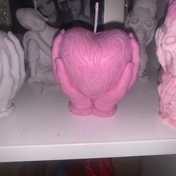 Heart in hand candle 
Beautifully detailed 
These can be made to order 

I can do blame one’s 
Coloured and or fragranced
The ones above are strawberry scented 

£10 each