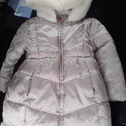 Girls winter coat. thick padded material with fur hood. Never worn, is new just without tags. only defect is her name is written inside. size 3 to 5 years