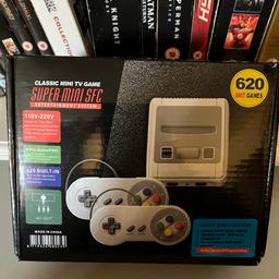 Box states: Classic TV game. Super mini SFC entertainment system. 620 8bit retro games. 

Looks like a SNES. Is not produced by Nintendo. It’s basically a mini emulator. Easy plug and play and no need to download anything. Uses tv AV. 
Never used. All contents in box as new. 
Good fun for traveling.