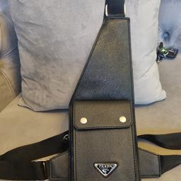 Prada harness crossbody bag  this harness crossbody bag features adjustable straps, a clasp fastening, a front flap pocket, and a front logo plaque. Great condition had it for some time never used anymore. Please ask all the relevant questions before purchasing.