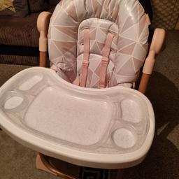 This high reclines back for when baby is asleep is very padded its very comfy and lowers to your needs and the inner tray comes off too.