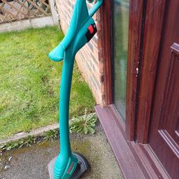 Bosch easytrim accu cordless garden strimmer with battery and charger in good working order can be seen working ideal for tidying grave allotment etc bargain at just £35 NO OFFERS DARWEN BB3 0DU OR BOLTON BL3 2JP
