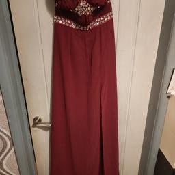 Burgundy strapless prom/bridesmaid/special occasion dress by lipsy 
Brand new with tags 
Size uk 8
Please note 
There are a few little pulls on the right shoulder as I've tried to highlight in the last 2 pics but these should be able for somebody to sort out